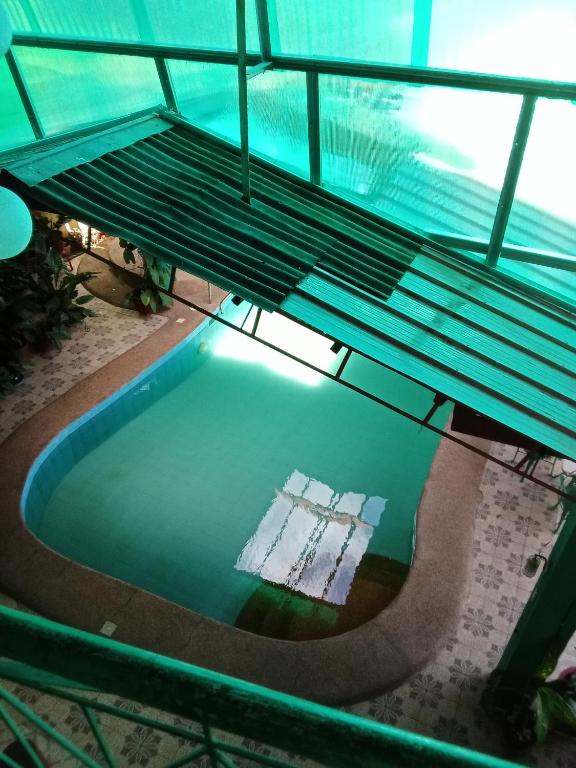 an overhead view of a swimming pool in a building at Villa Ceferina in Tagbilaran City