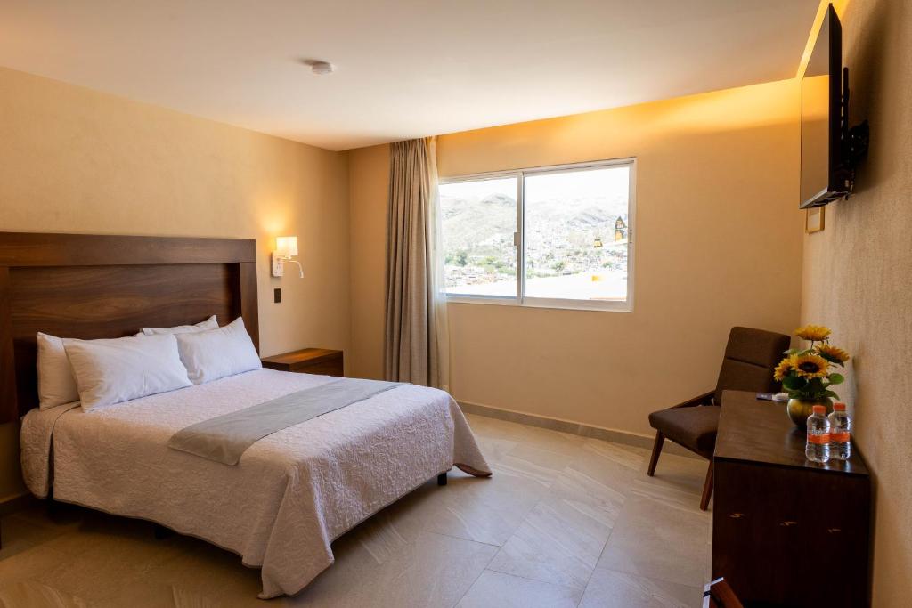 Postel nebo postele na pokoji v ubytování Hotel Balcón del Cielo