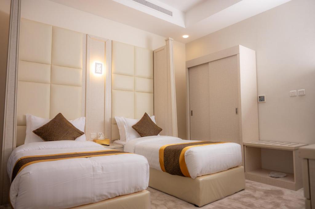 Postel nebo postele na pokoji v ubytování Areen Hotel فندق ارين