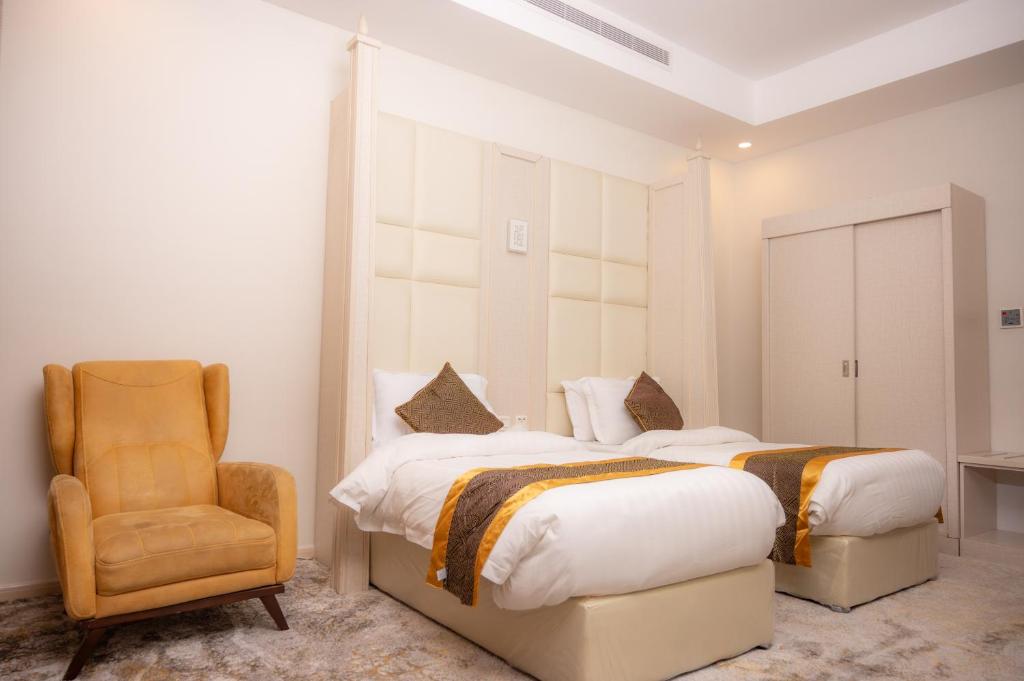 Postel nebo postele na pokoji v ubytování Areen Hotel فندق ارين