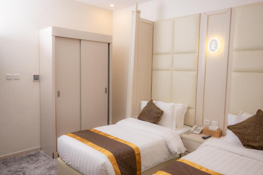 Postel nebo postele na pokoji v ubytování Areen Hotel فندق ارين