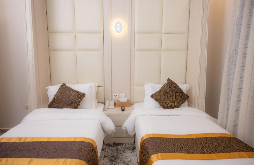 Postel nebo postele na pokoji v ubytování Areen Hotel فندق ارين