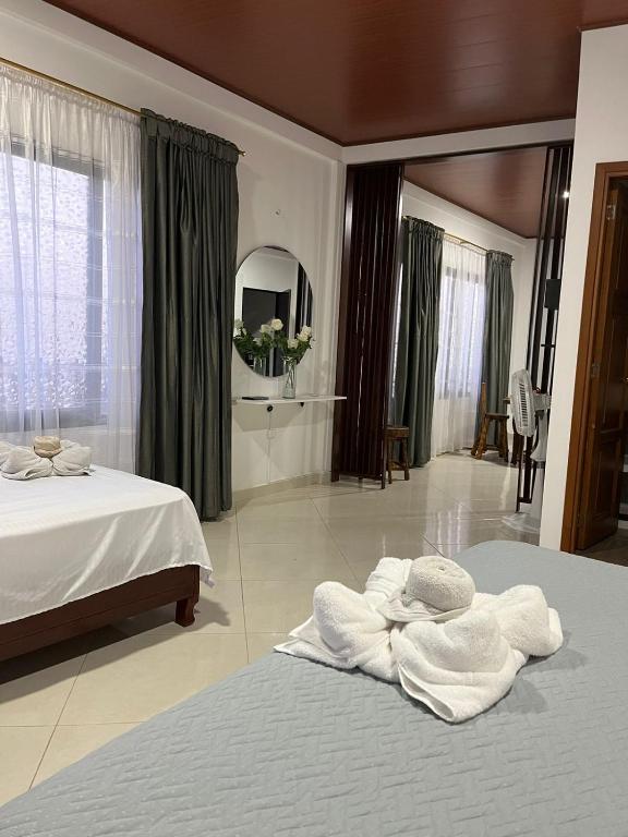 Postel nebo postele na pokoji v ubytování Hotel la casona de Wiky