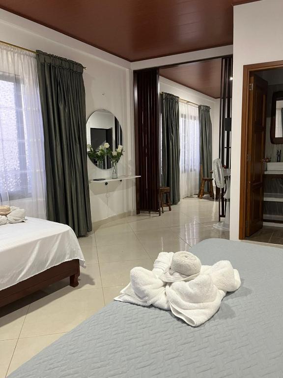 Postel nebo postele na pokoji v ubytování Hotel la casona de Wiky