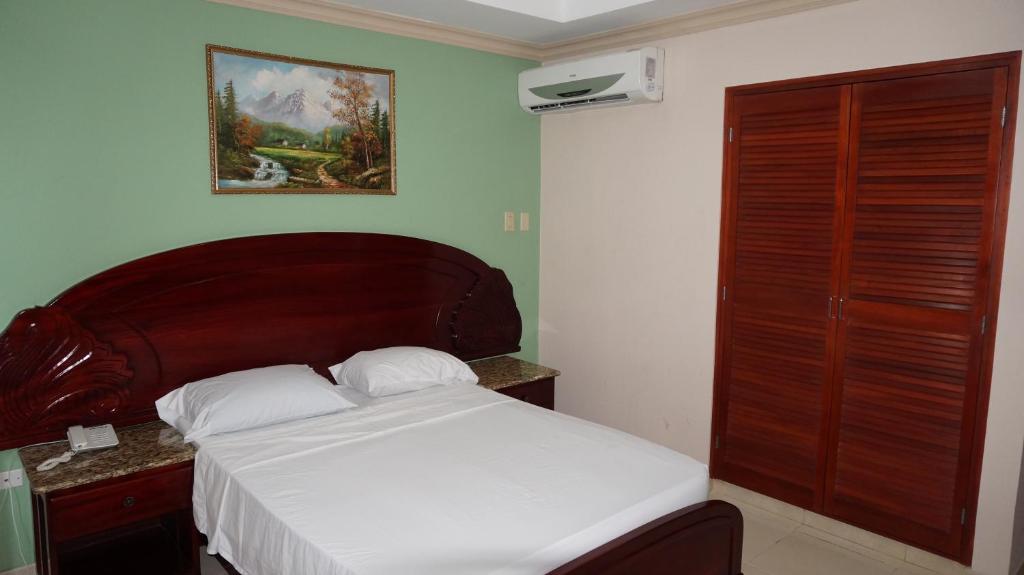 Postel nebo postele na pokoji v ubytování Residencial El Amanecer