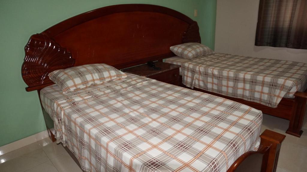Postel nebo postele na pokoji v ubytování Residencial El Amanecer