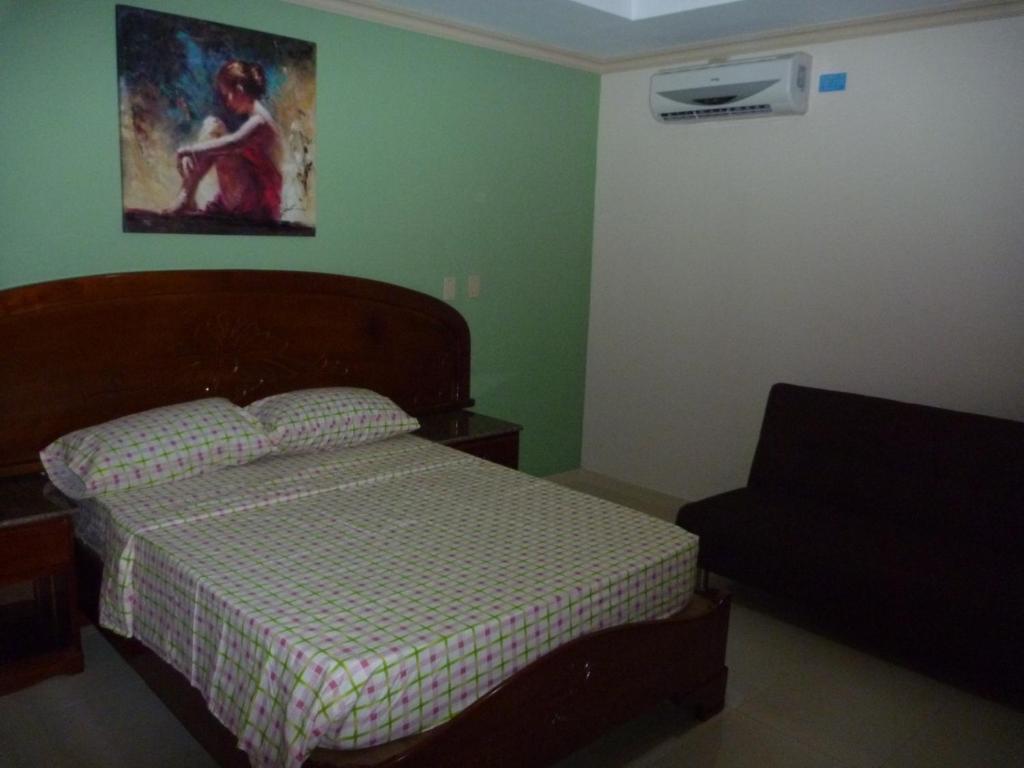 Postel nebo postele na pokoji v ubytování Residencial El Amanecer