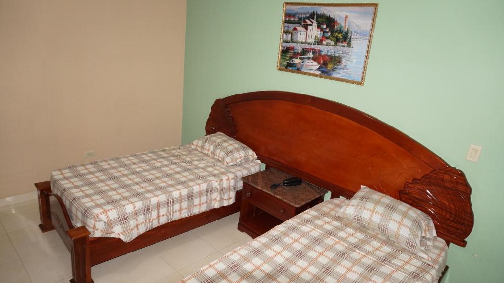 Postel nebo postele na pokoji v ubytování Residencial El Amanecer