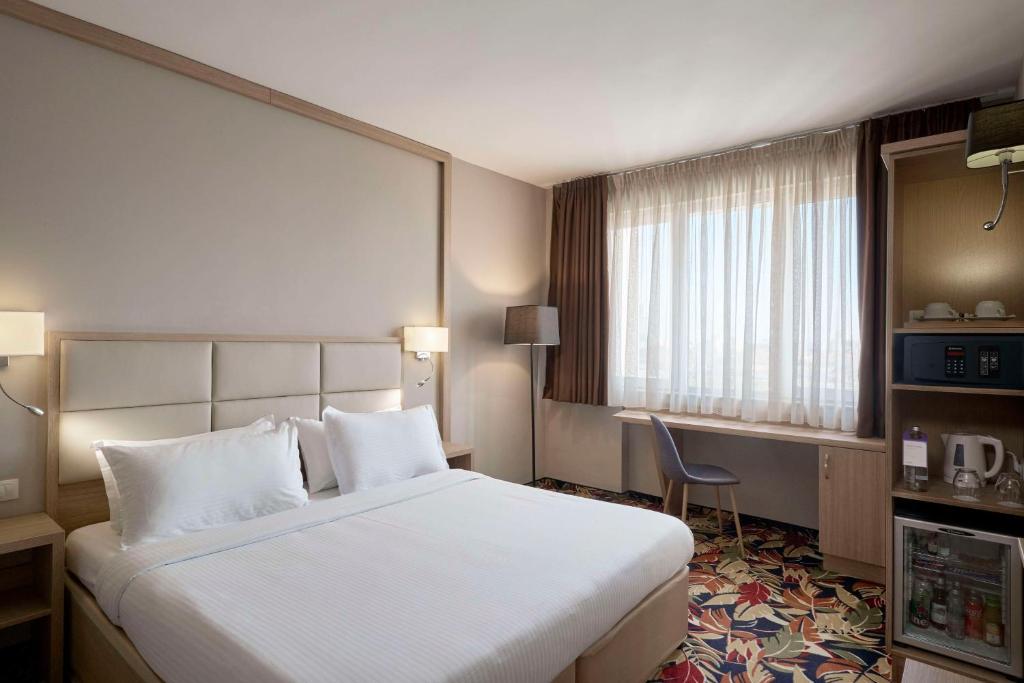Säng eller sängar i ett rum på Radisson Hotel Plovdiv