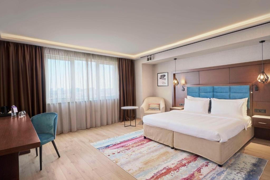 Säng eller sängar i ett rum på Radisson Hotel Plovdiv