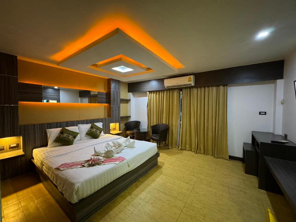 Ένα ή περισσότερα κρεβάτια σε δωμάτιο στο MrMac's Place