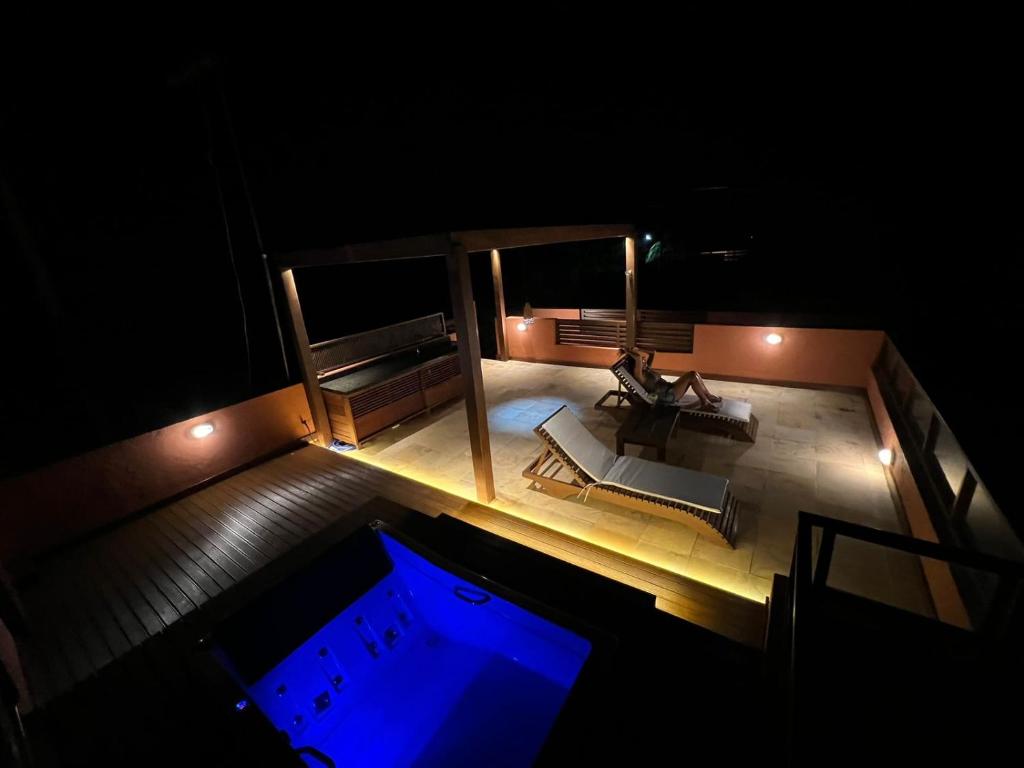 an overhead view of a swimming pool at night at Flat com Terraço Pipa Beleza Resort in Pipa