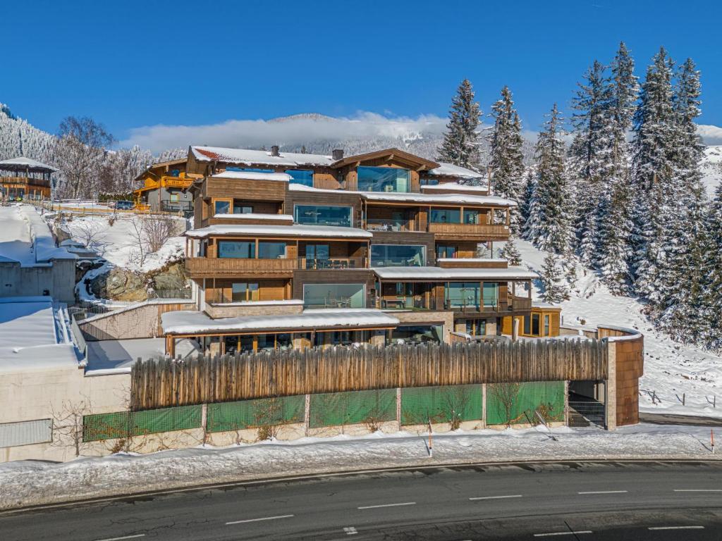 a building on the side of a snow covered mountain at Kitzbüheler Alpenlodge Top A8 in Mittersill