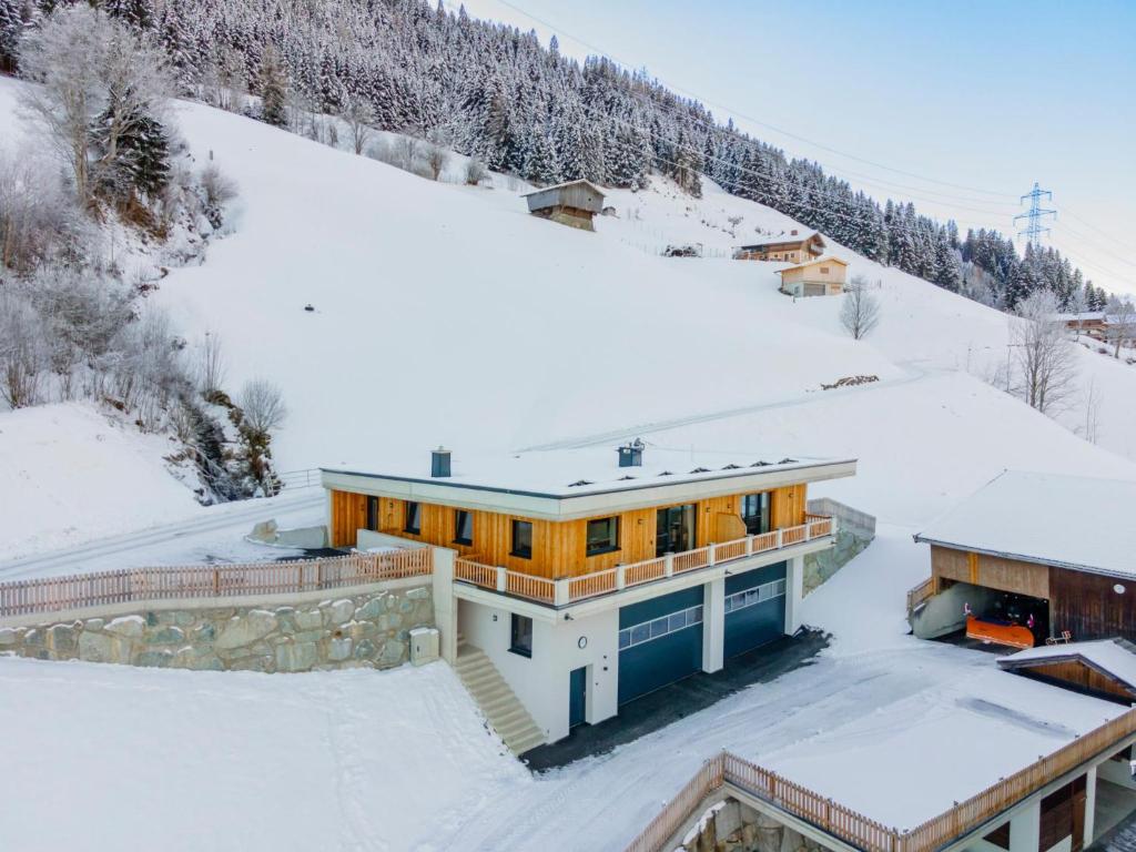 a house on top of a snow covered mountain at Hoferlitzlhubgut in Mittersill