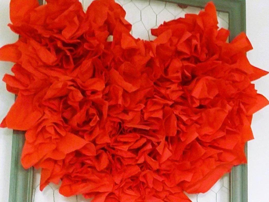 a pile of red flowers in a green frame at Gîte Le Bernard, 6 pièces, 10 personnes - FR-1-426-164 in Le Bernard