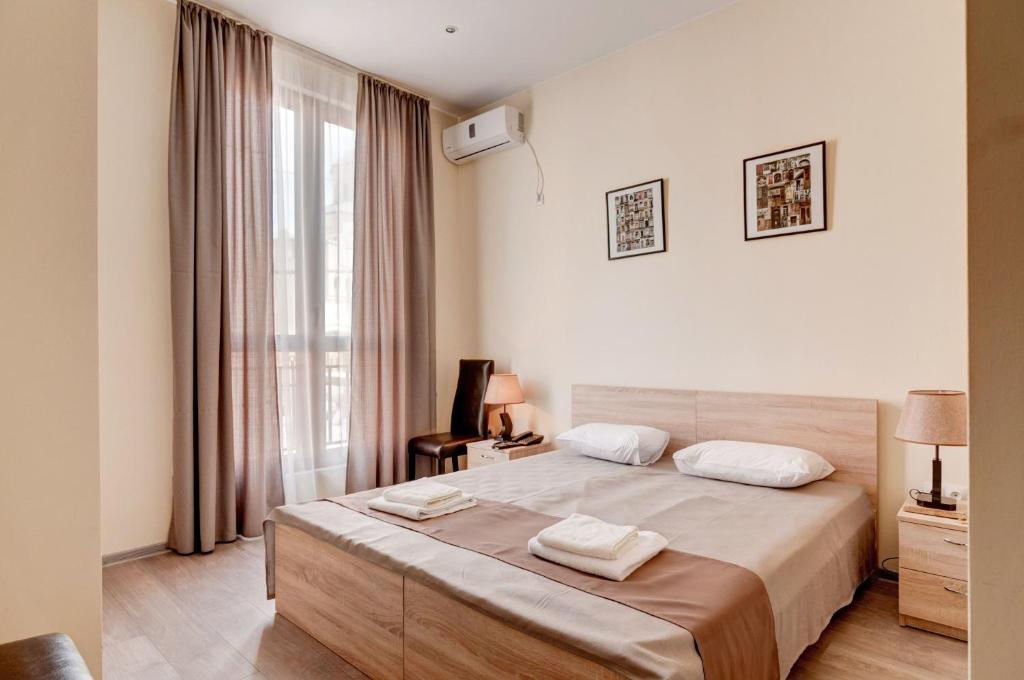 Postel nebo postele na pokoji v ubytování Liva Hotel