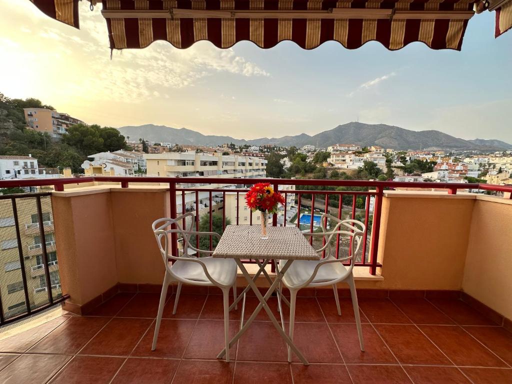 a table and chairs on a balcony with a view at Studio in Costa Del Sol, Sea, Sunshine & Views in Fuengirola