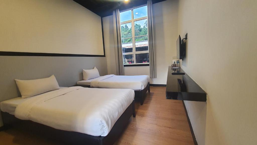 Postel nebo postele na pokoji v ubytování H Benjamin Residence