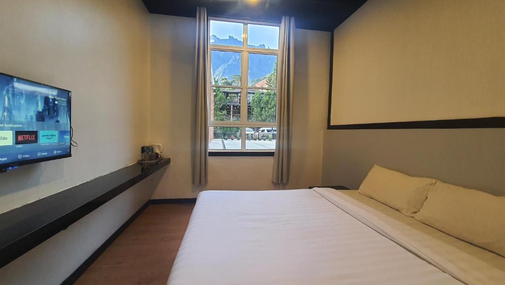 Postel nebo postele na pokoji v ubytování H Benjamin Residence