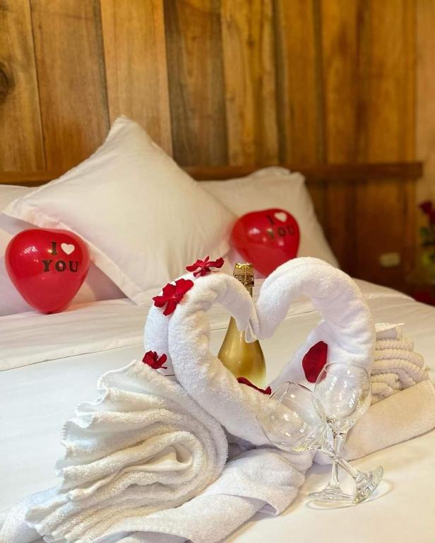 Postel nebo postele na pokoji v ubytování Guayabo Hostal Mindo