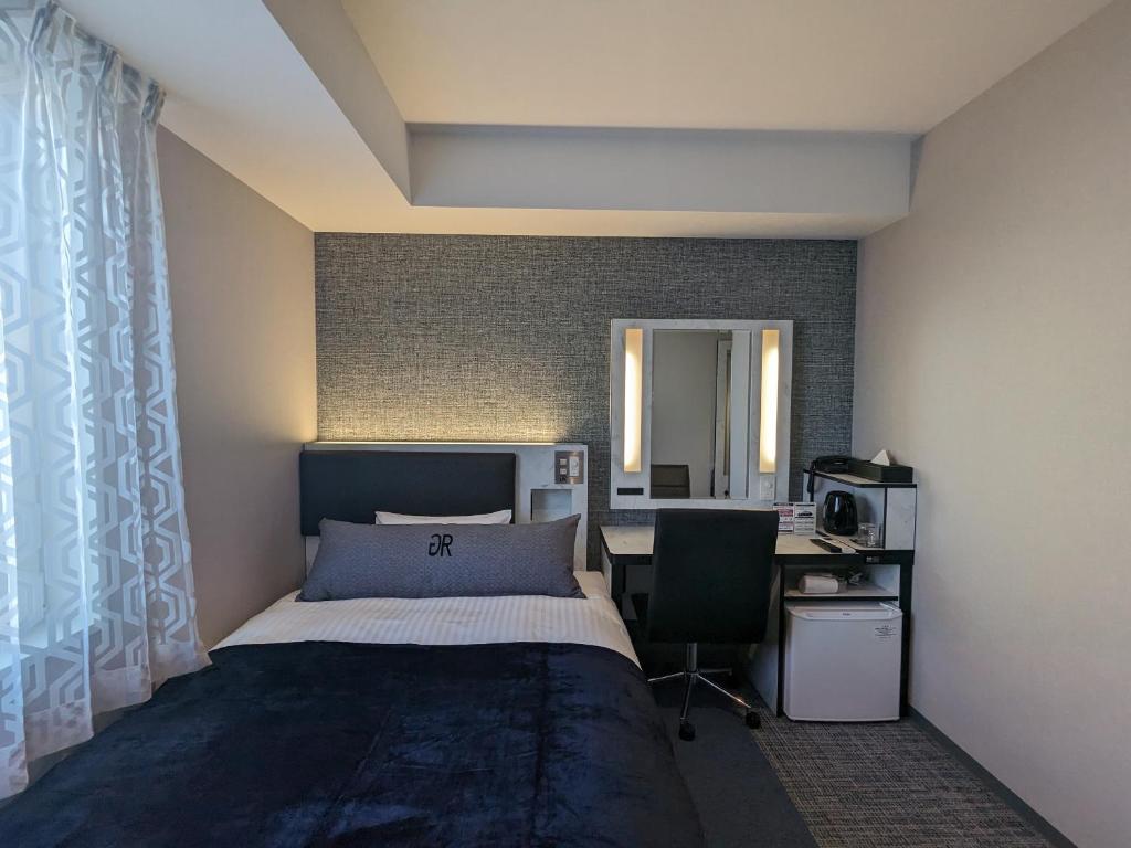 Postel nebo postele na pokoji v ubytování Green Rich Hotel Tokuyama Ekimae