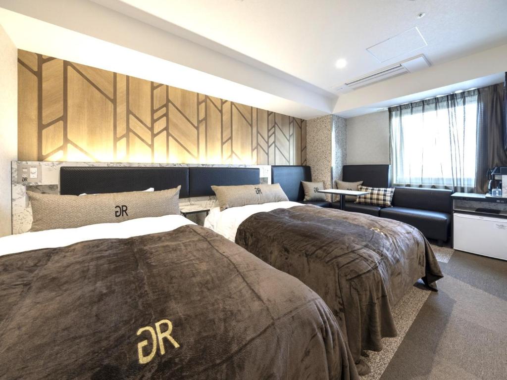 Postel nebo postele na pokoji v ubytování Green Rich Hotel Tokuyama Ekimae
