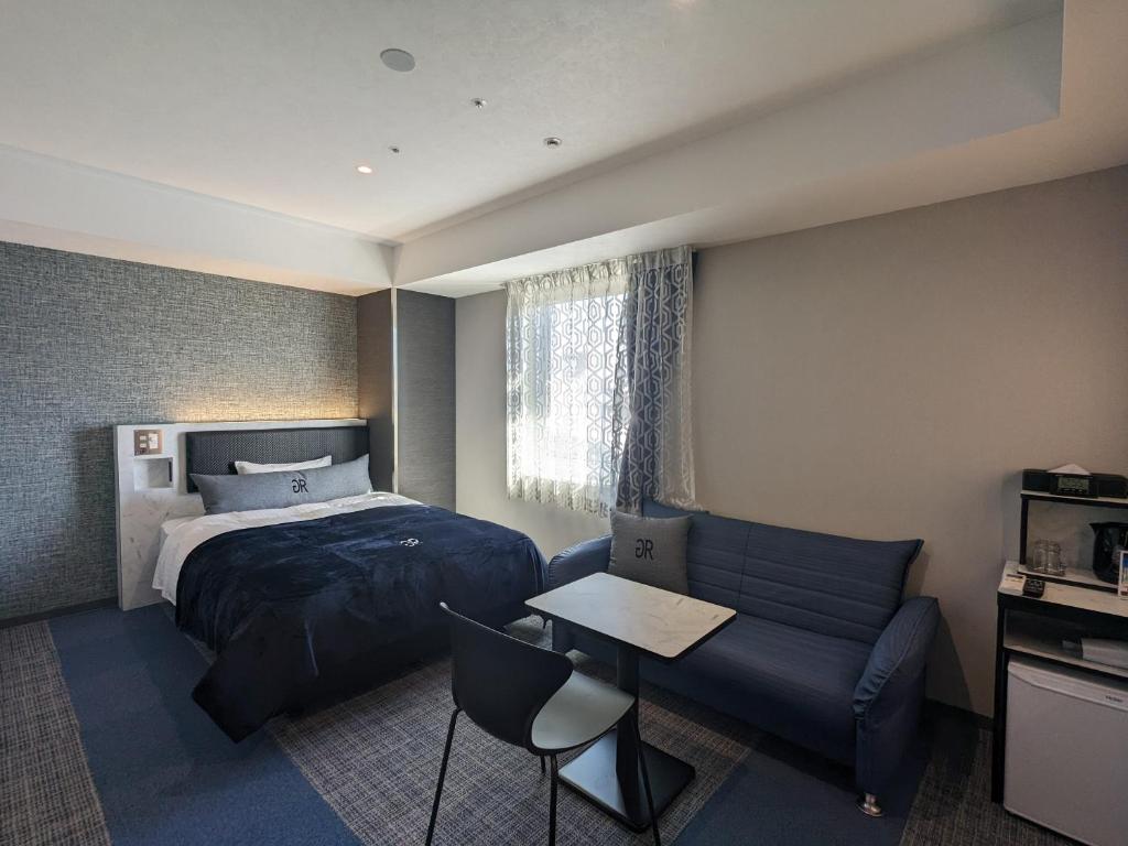 Postel nebo postele na pokoji v ubytování Green Rich Hotel Tokuyama Ekimae