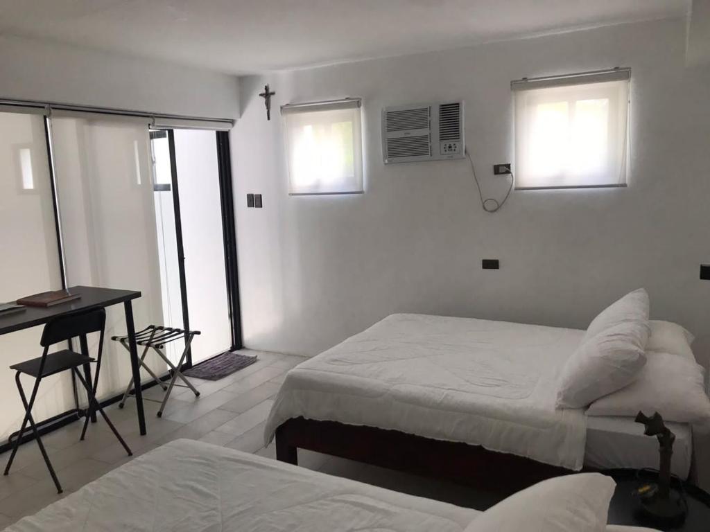 Postel nebo postele na pokoji v ubytování Paradores Filipinas