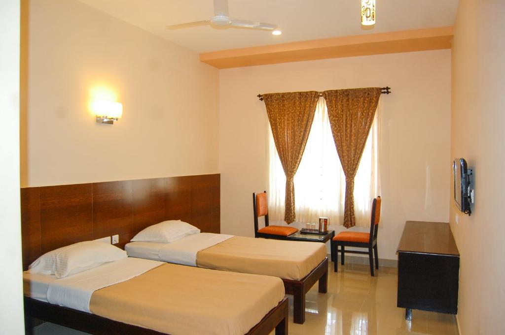 Postel nebo postele na pokoji v ubytování Philomena Hotel & Apartment