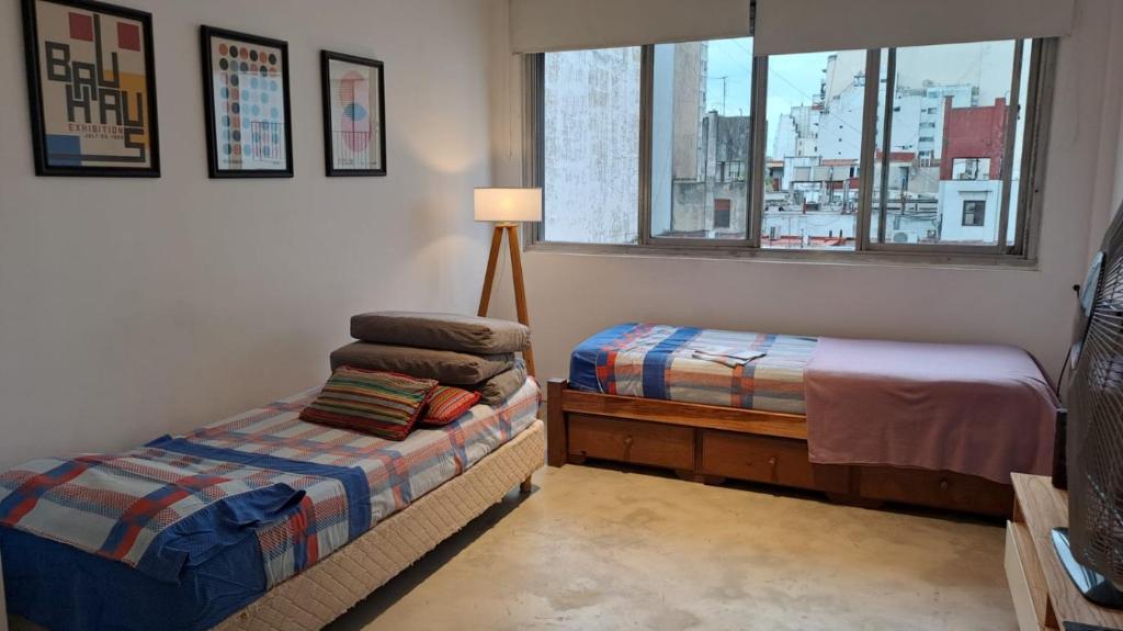 Voodi või voodid majutusasutuse Excelente departamento en San Telmo toas