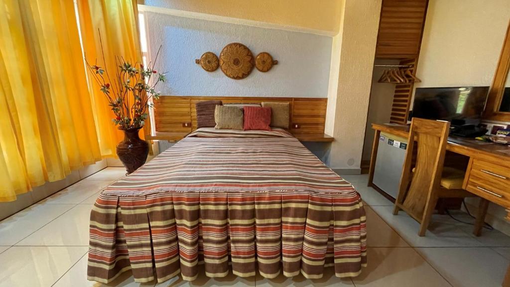 Postel nebo postele na pokoji v ubytování CITI HOTEL