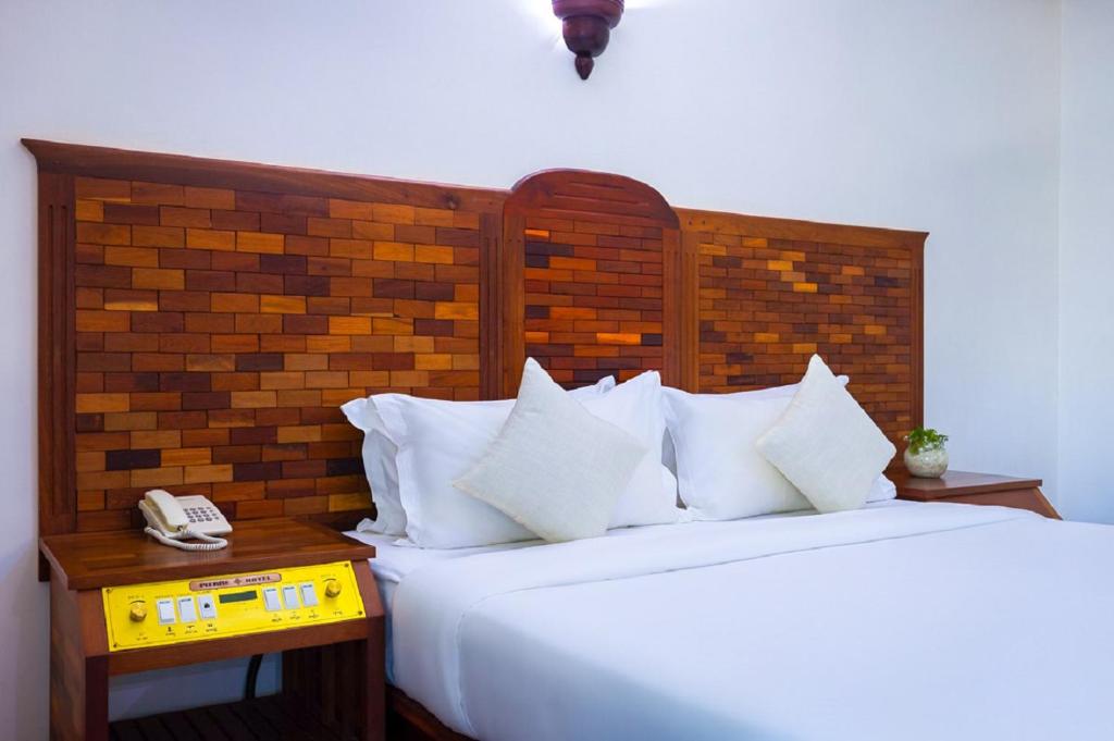 Postel nebo postele na pokoji v ubytování Pierre Hotel