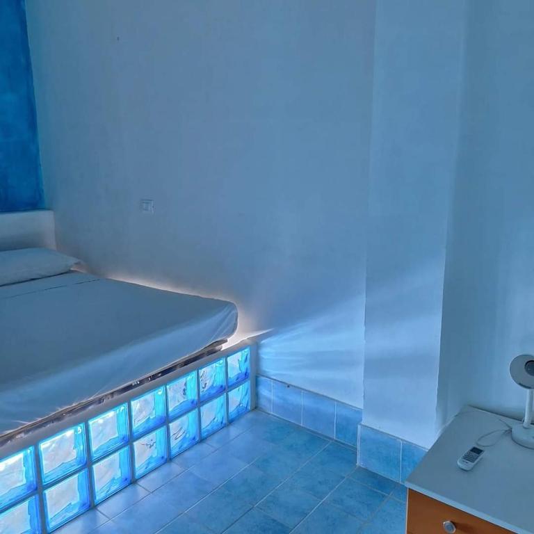 Postel nebo postele na pokoji v ubytování Suite House L'Isola Che Non C'è