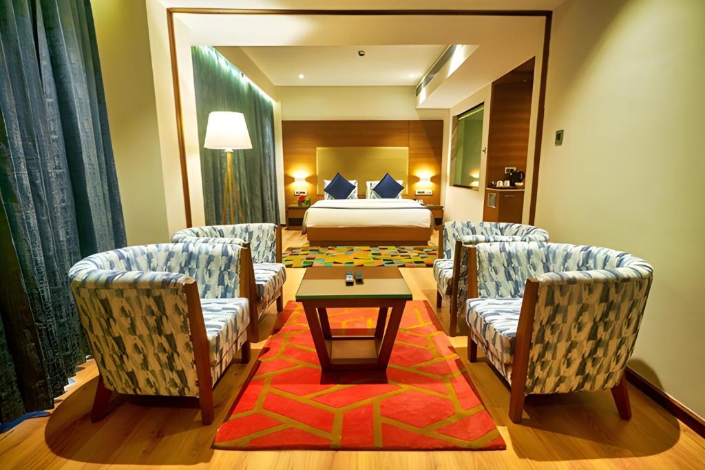 Postel nebo postele na pokoji v ubytování Vibe Munnar Resort & Spa