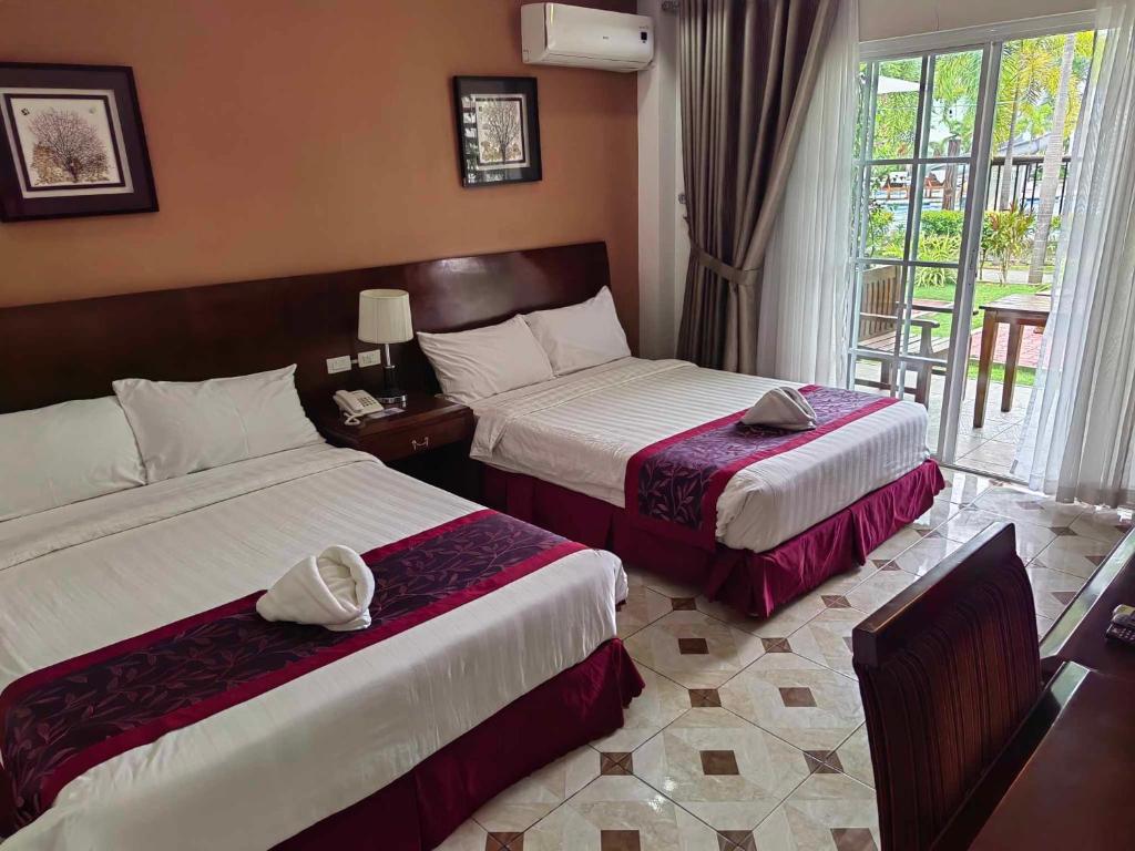 Postel nebo postele na pokoji v ubytování Marand Family Resort