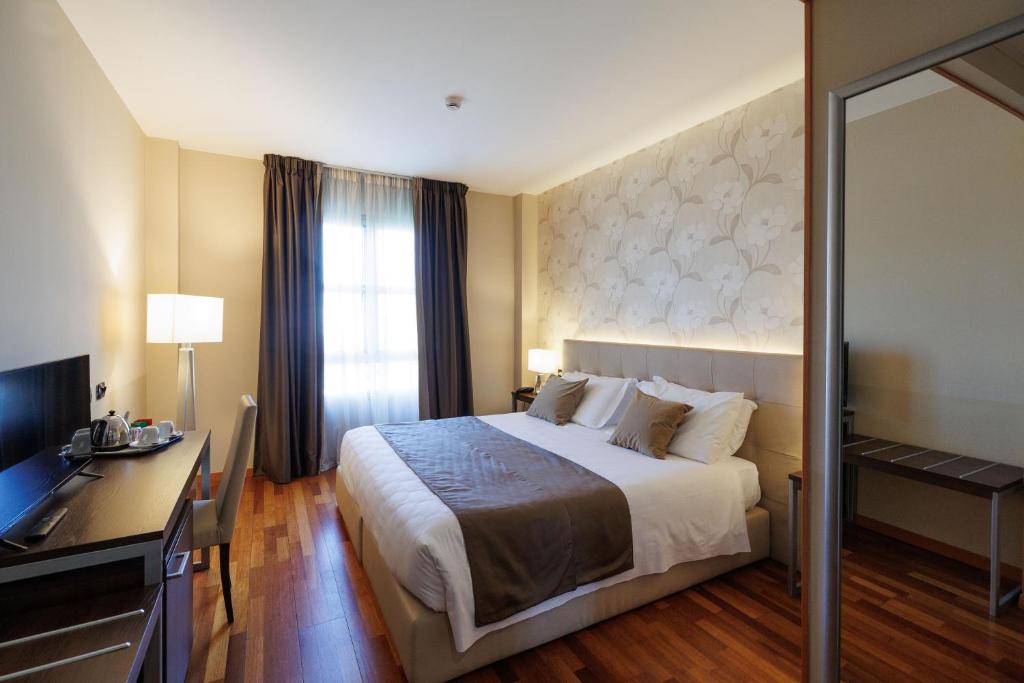 Postel nebo postele na pokoji v ubytování Charme Hotel