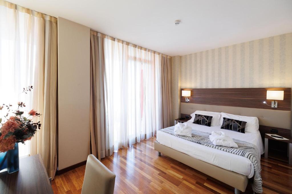 Postel nebo postele na pokoji v ubytování Charme Hotel
