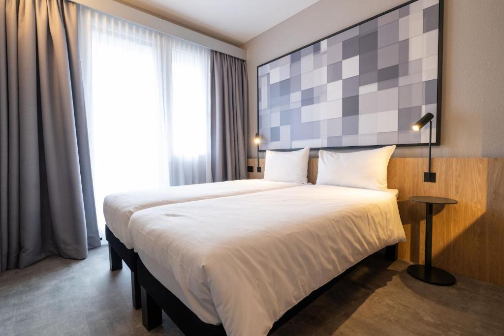 Postel nebo postele na pokoji v ubytování ibis Chur