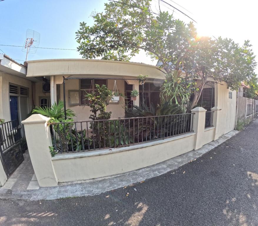 a house with a fence in front of it at Omah Tegalrejo Family Only in Jetis