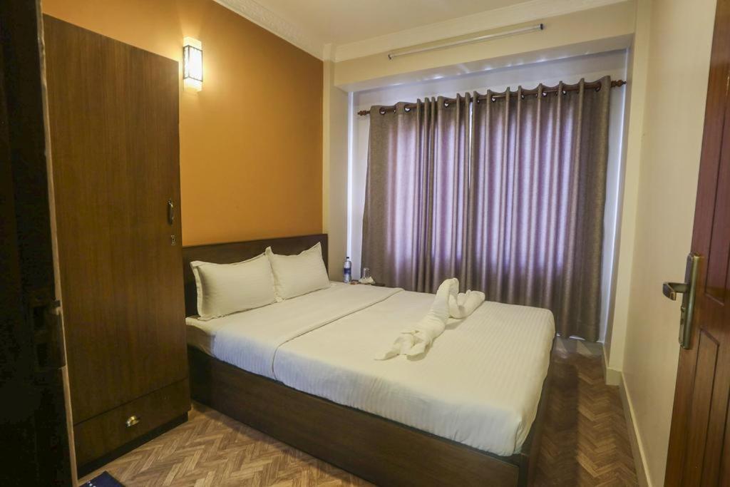 Postel nebo postele na pokoji v ubytování Paradise Guest House