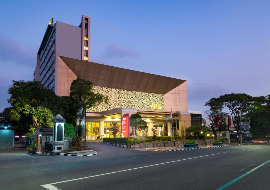 a building on the side of a city street at Atria Hotel Magelang in Magelang