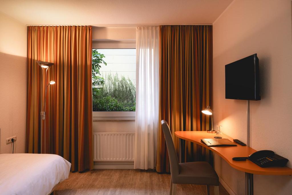 TV a/nebo společenská místnost v ubytování Hotel Astra
