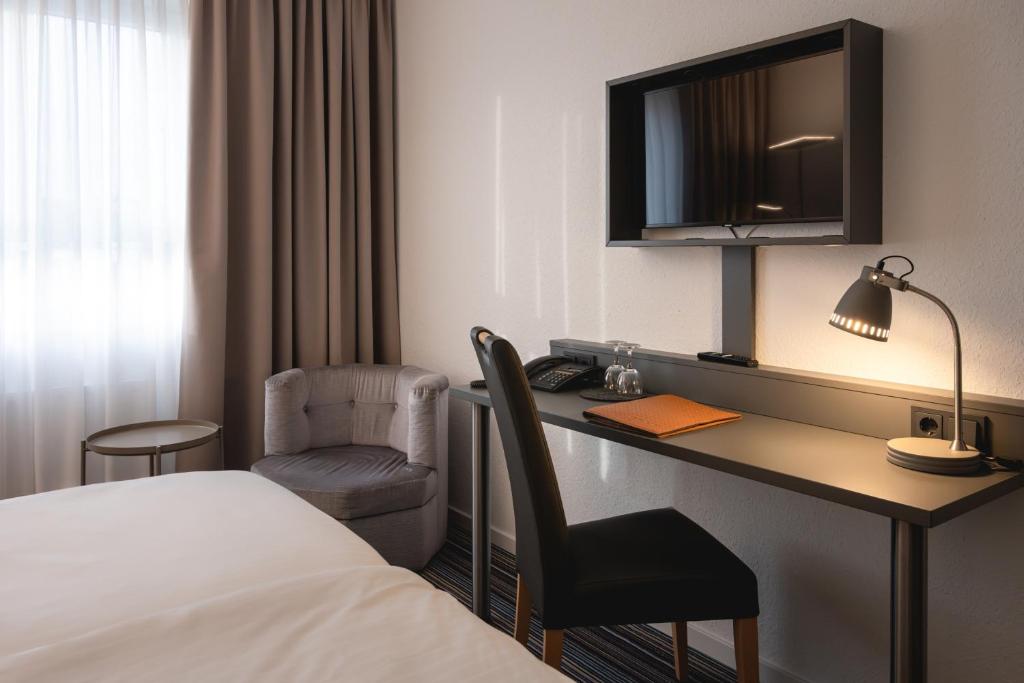 TV a/nebo společenská místnost v ubytování Hotel Astra