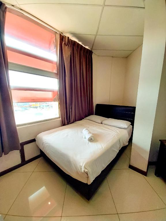 Postel nebo postele na pokoji v ubytování MB Budget Hotel