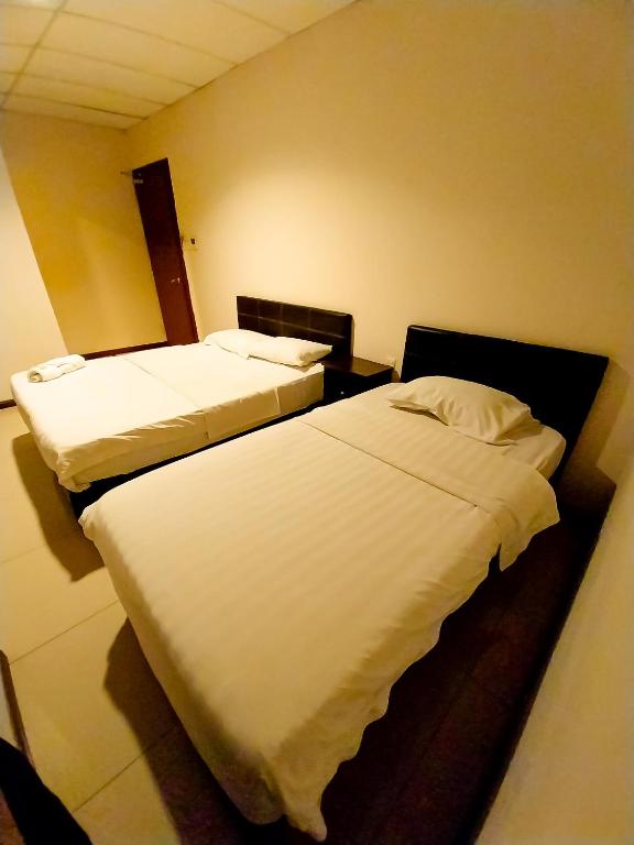 Postel nebo postele na pokoji v ubytování MB Budget Hotel