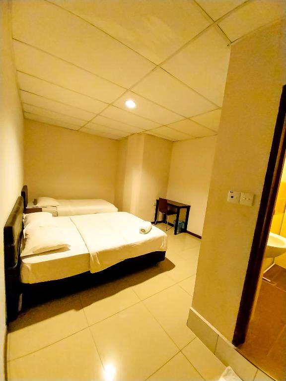 Postel nebo postele na pokoji v ubytování MB Budget Hotel
