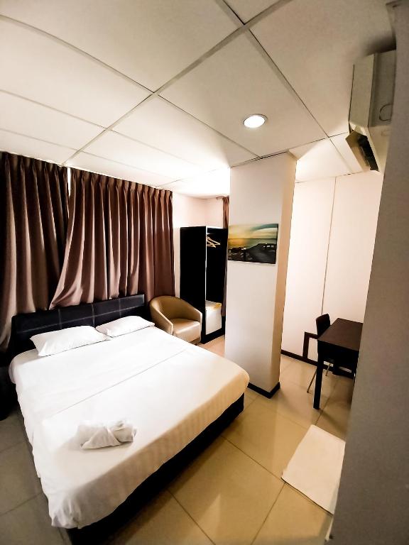Postel nebo postele na pokoji v ubytování MB Budget Hotel