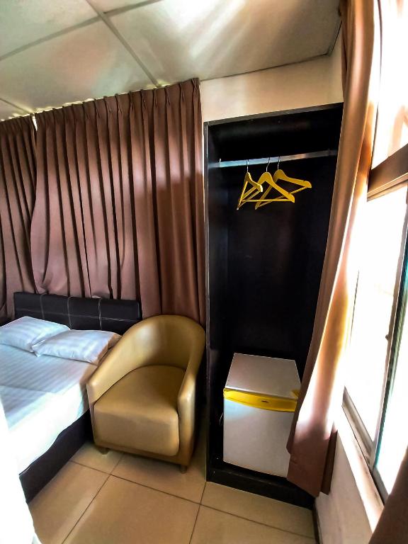 Postel nebo postele na pokoji v ubytování MB Budget Hotel