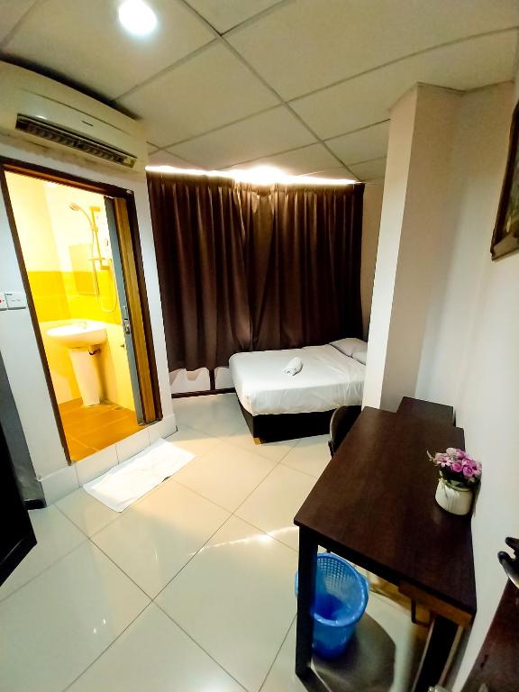 Postel nebo postele na pokoji v ubytování MB Budget Hotel