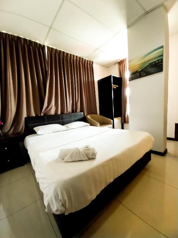 Postel nebo postele na pokoji v ubytování MB Budget Hotel